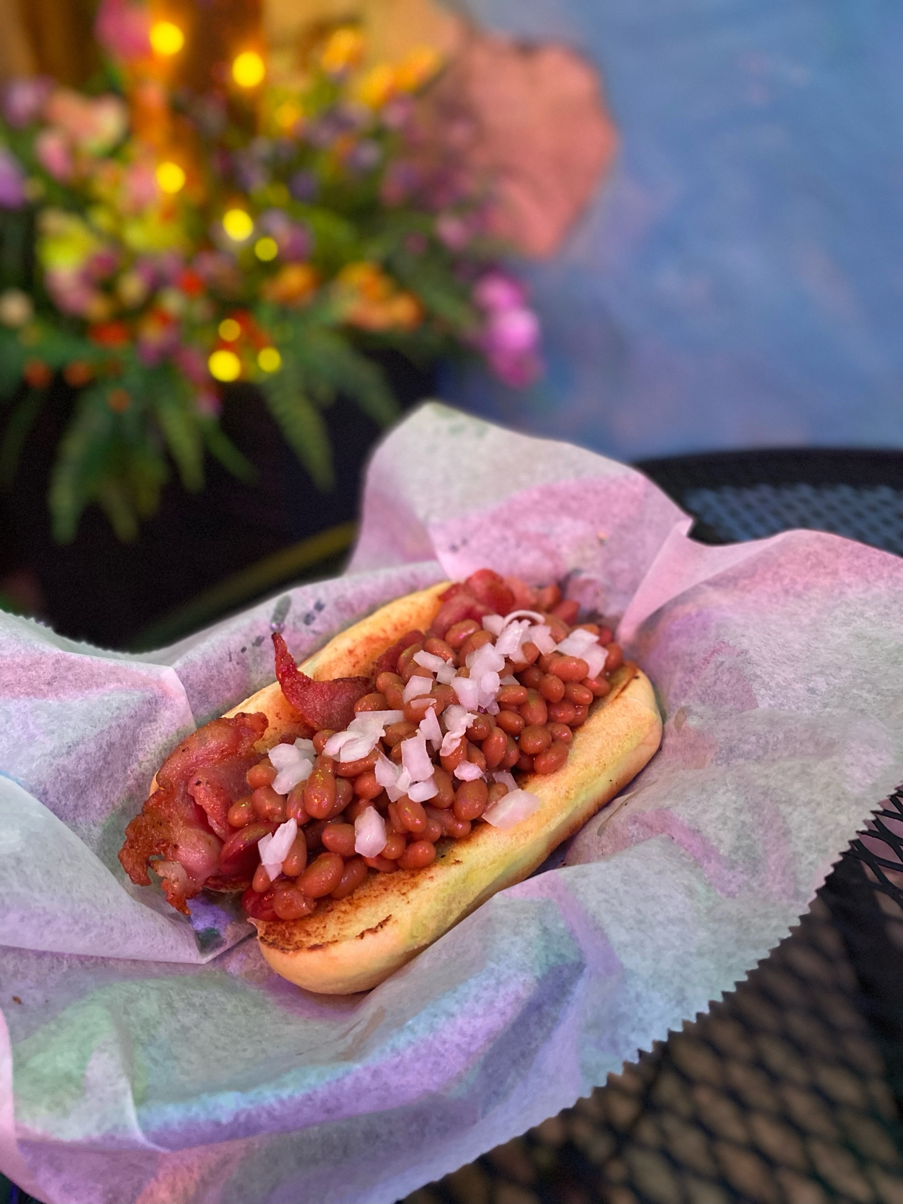 Glizzy topped with house-made beans and bacon at Jitters